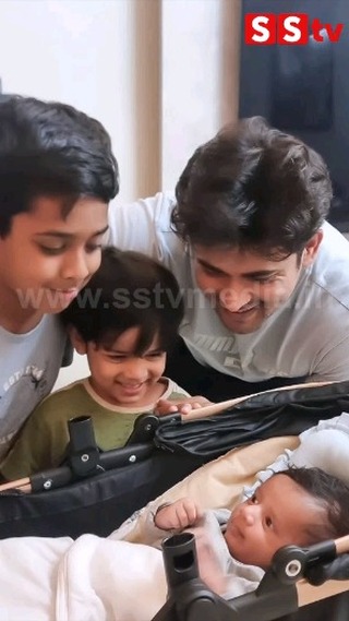 Chandan happily hugged his son