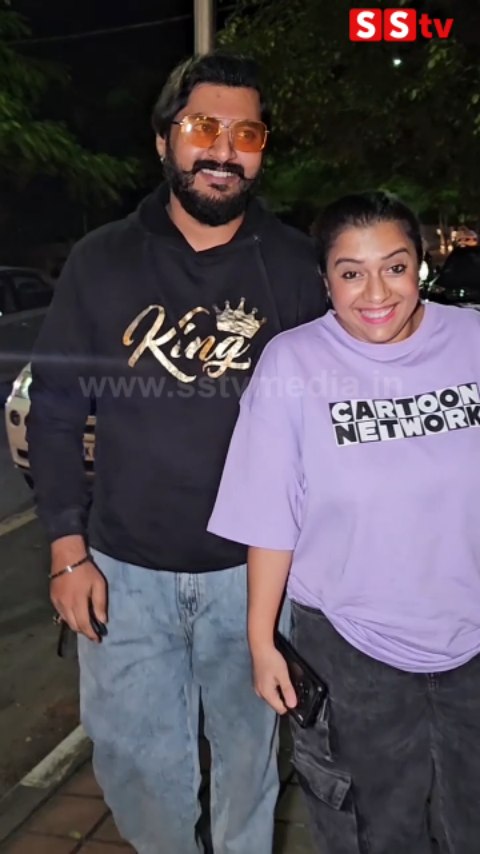 Niranjan Deshpande and his wife enter The Bloom Cafe