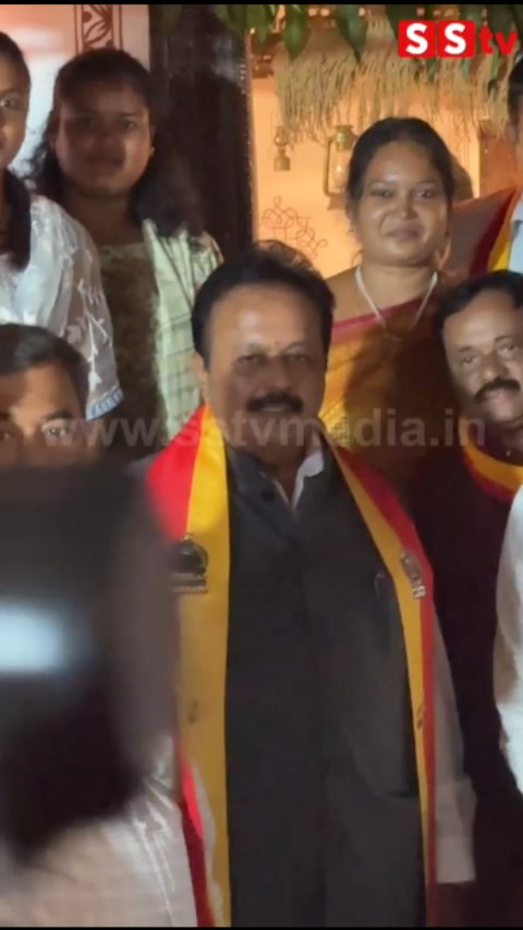 Chaluvaraya Swamy poses for a photo with fans