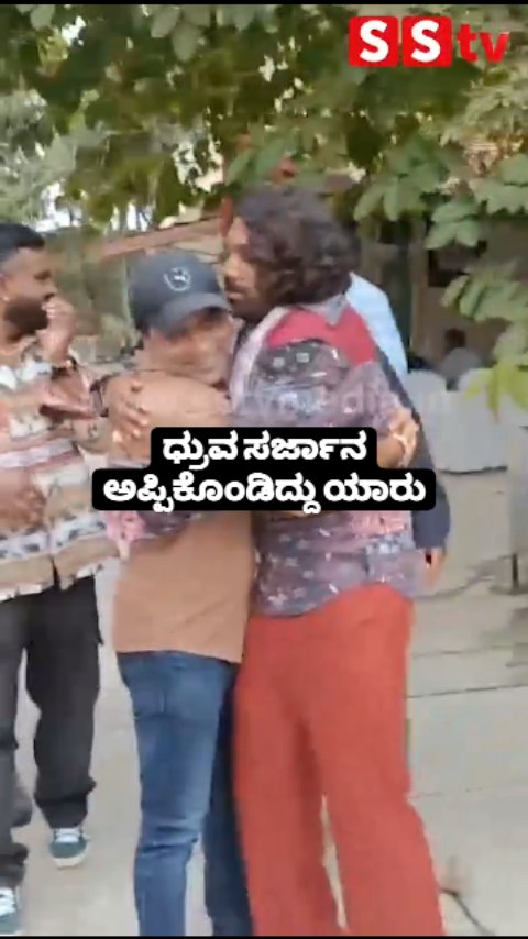 Who is hugging a Dhruva Sarja