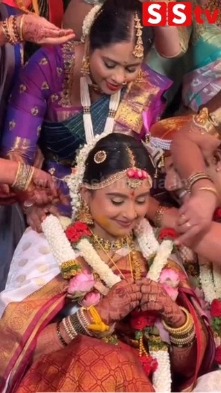 Shyness on Chandan's face while tying the tali