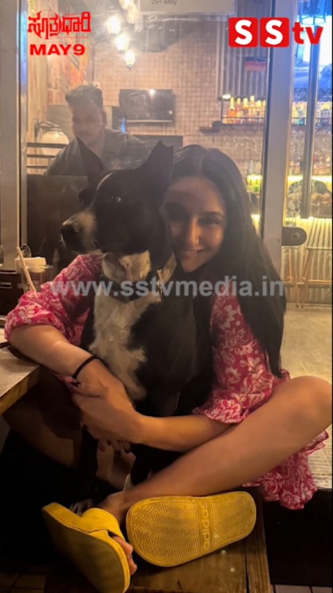 Ragini cuddling with the dog